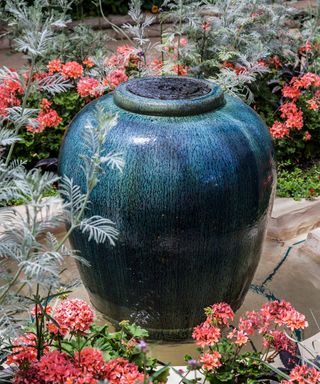 Longwood Gardens, botanical garden water fountain urn pot and Geranium flowers