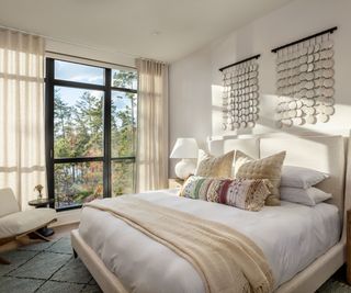 lakeside cabin bedroom with cream walls and furnishings