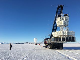 A team prepares ANITA for flight over the Antarctic ice.
