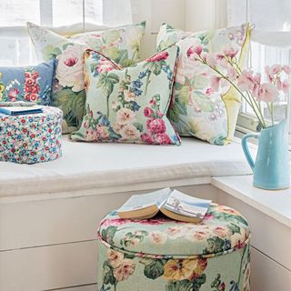 window side seating with floral cushion