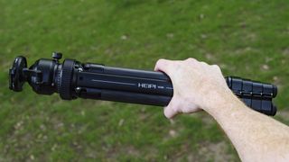 Heipi 3-in-1 Travel Tripod W28S folded away, in the hand