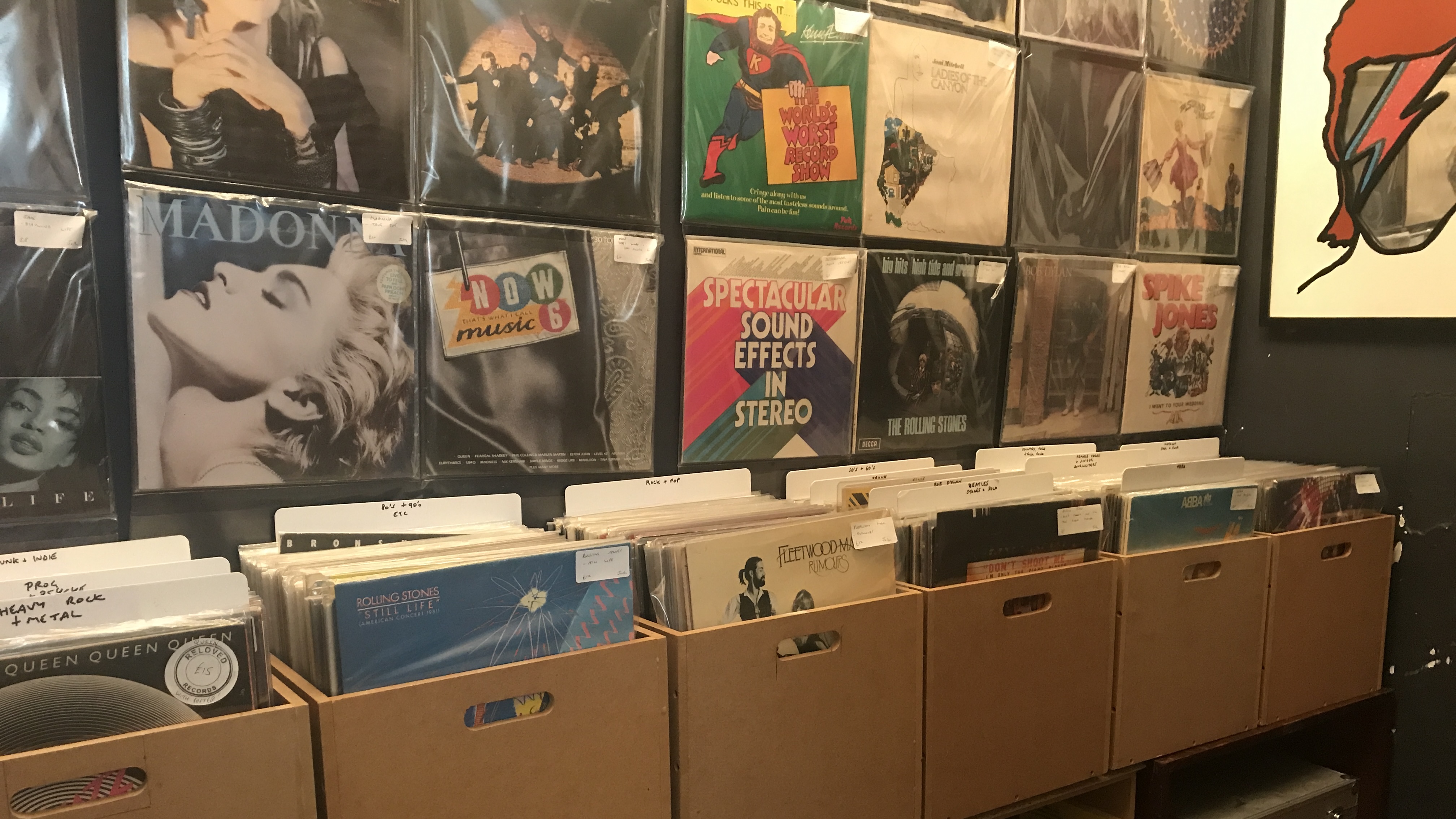 A photo of vinyl in boxes, in a store in Leeds UK called The Vinyl Whistle, owned by ex Premier League football referee, Jon Moss