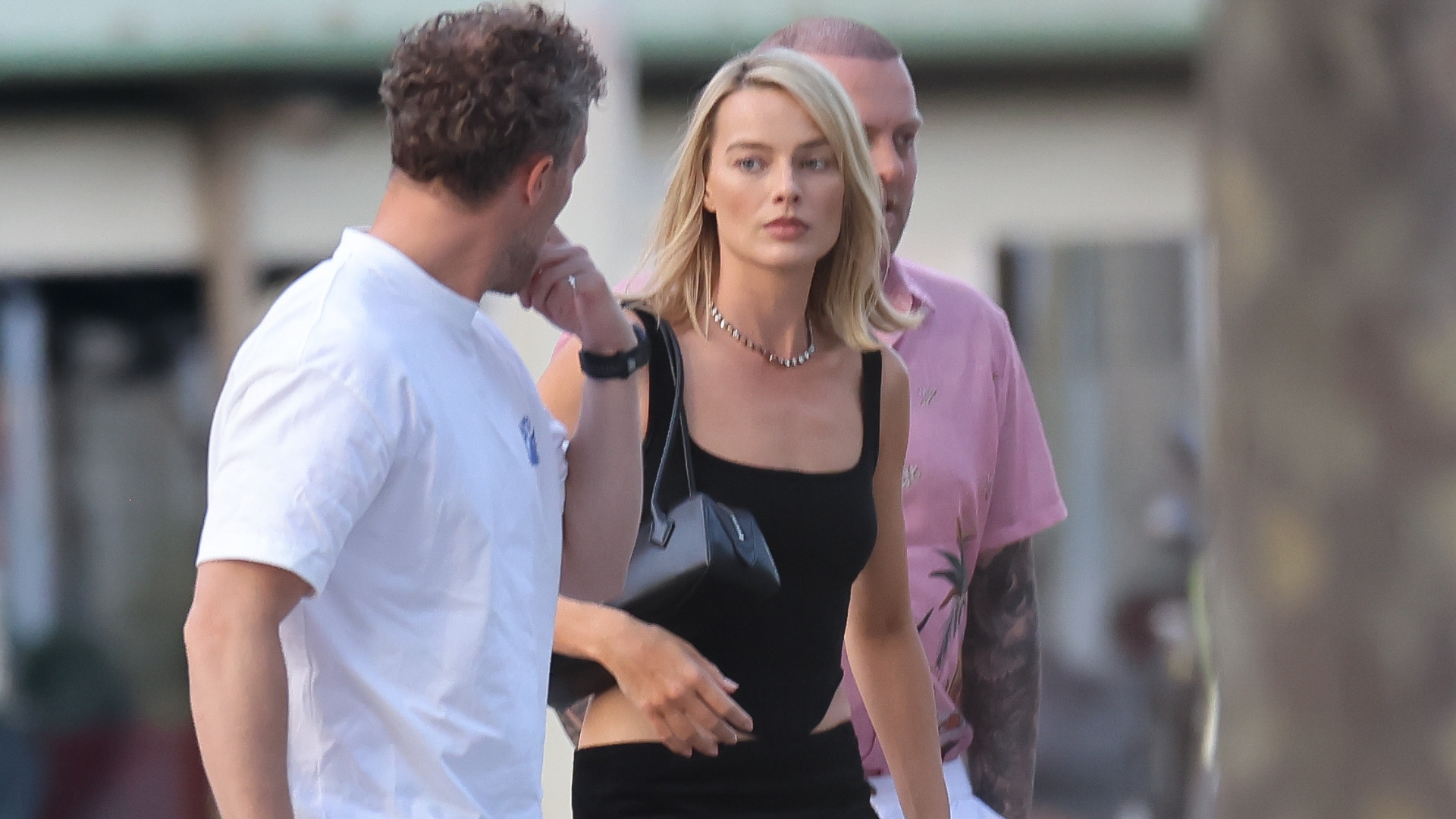 Margot Robbie steps out in a calf-length fish tail skirt and black t-bar high heels.