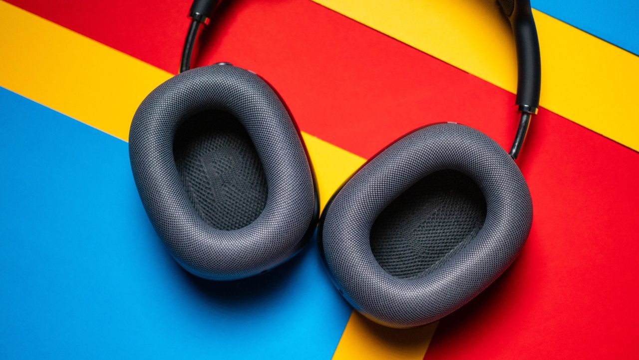 Apple AirPods Max 2 headset against a textured sheet showcasing the design