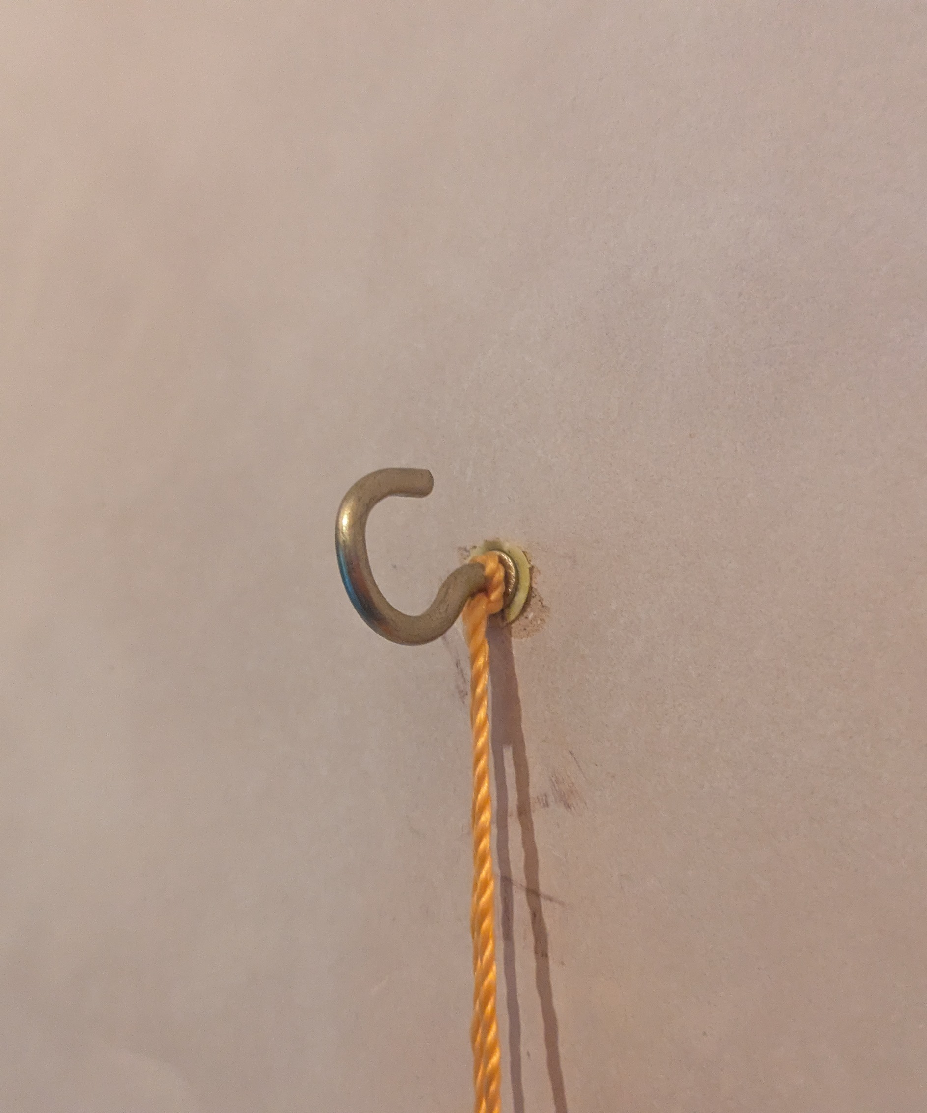 A hook with a string tied around it