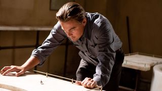 Cobb (Leonardo DiCaprio) watches his spinning top totem in a scene from "Inception"