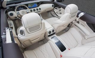 View from above, looking down into the car at the pale leather interior