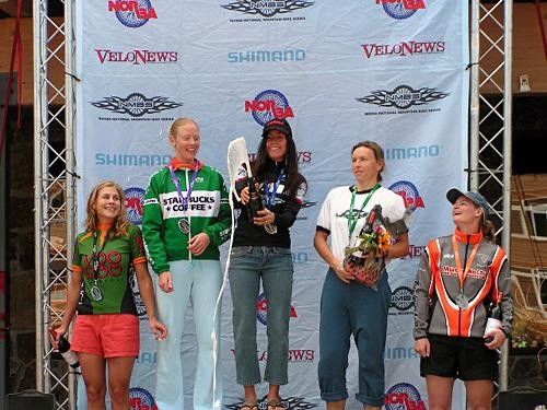 On the NORBA Schweitzer podium and spraying some champagne - something Monique has gotten used to