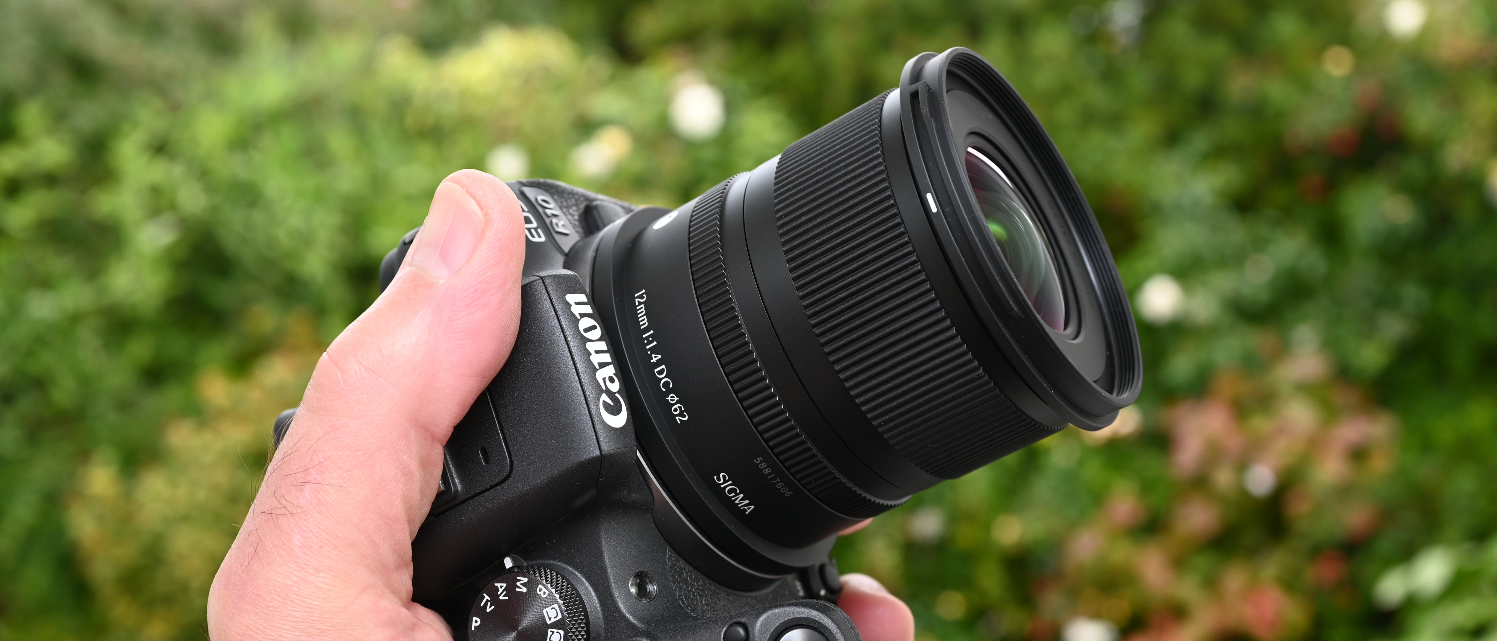 Sigma 12mm f/1.4 DC | C product image held in hand
