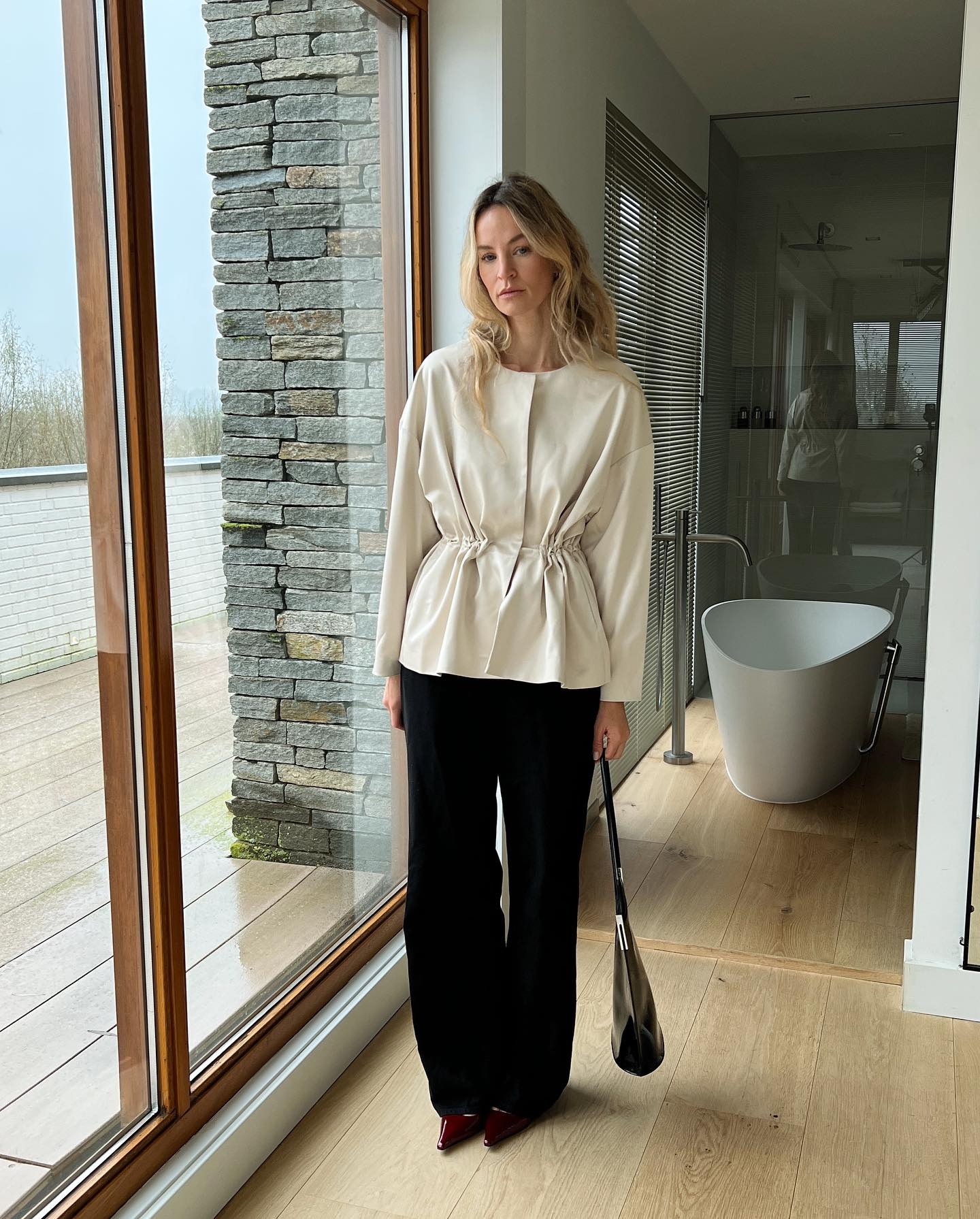 Woman wearing peplum top as a spring 2026 trend.