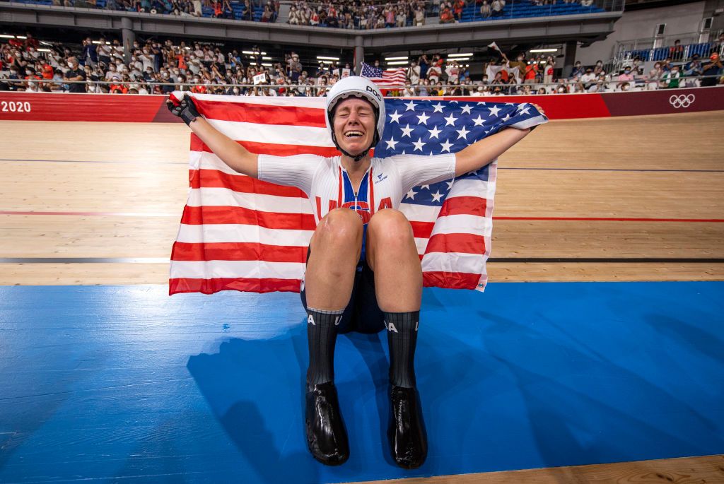 IZU JAPAN AUGUST 08 Jennifer Valente of Team United States celebrates winning the gold medal while holding the flag of her country during the Womens Omnium points race 4 round of 4 of the track cycling on day sixteen of the Tokyo 2020 Olympic Games at Izu Velodrome on August 08 2021 in Izu Shizuoka Japan Photo by Justin SetterfieldGetty Images