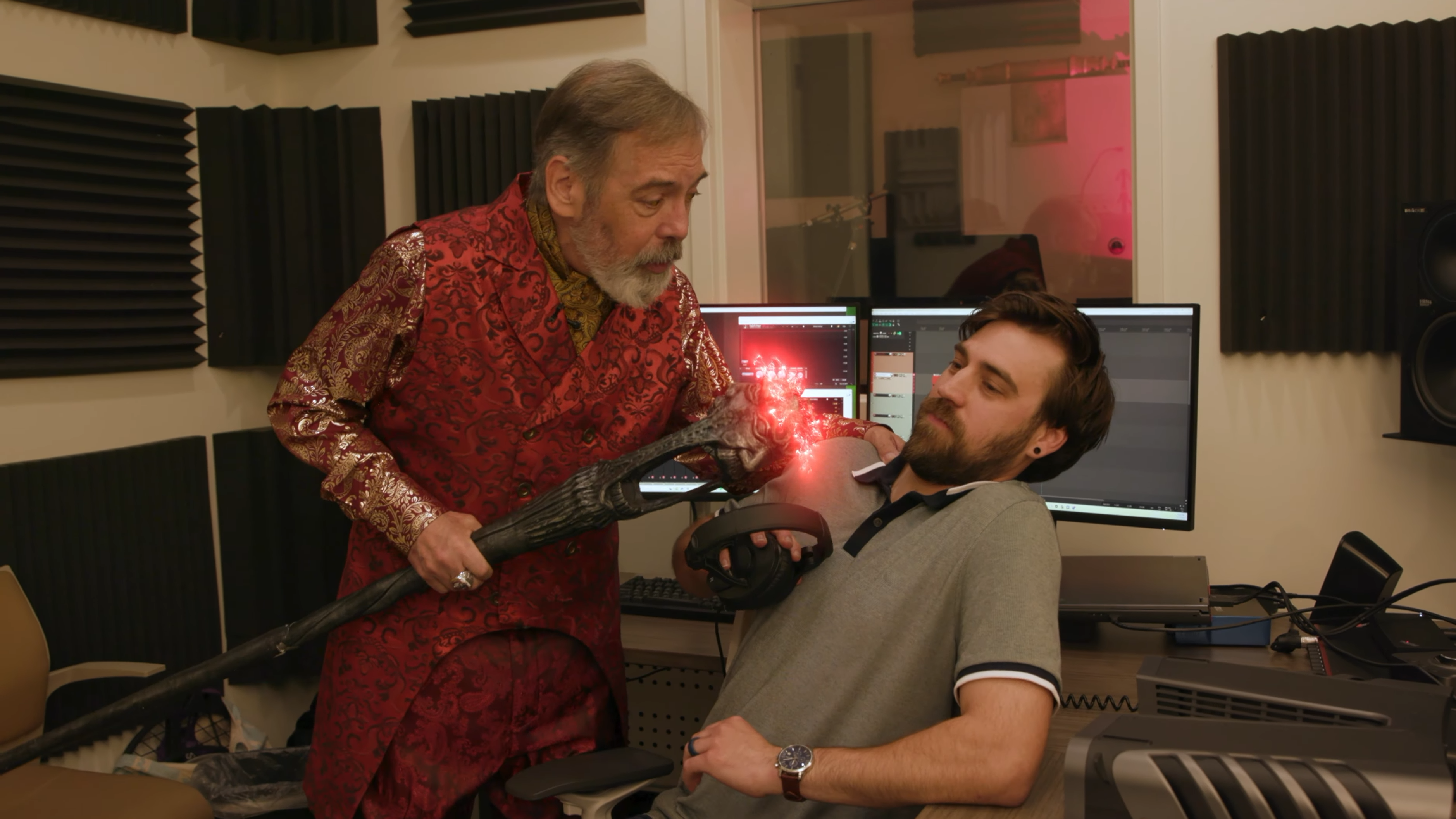 Wes Johnson, in the role of Sheogorath, threatens a sound technician with a magic staff.