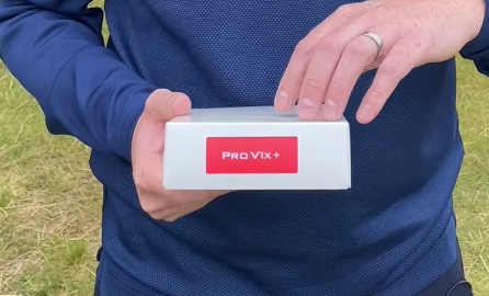 The Titleist Pro V1x Plus on a white box