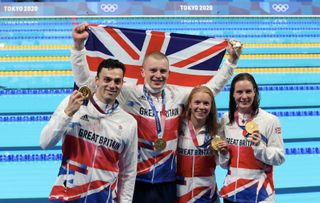 Gold medalists Adam Peaty, James Guy, Anna Hopkin and Kathleen Dawson of Team Great Britain poses during the medal ceremony for the Mixed 4 x 100m Medley Relay Final