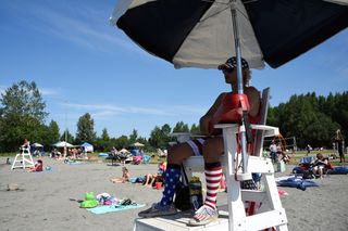 Lifeguard Luke Orot at Jewel Lake on July 4, 2019, in Anchorage, Alaska, which is bracing for record-warm temperatures.