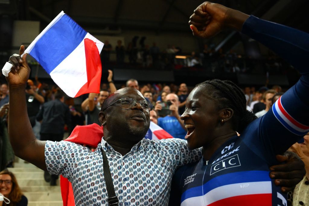 Frances Taky Marie Divine Kouame celebrates her victory with family members after winning the Womens 500m time trial final during the UCI Track Cycling World Championships at the Velodrome of SaintQuentinenYvelines southwest of Paris on October 15 2022 Photo by AnneChristine POUJOULAT AFP Photo by ANNECHRISTINE POUJOULATAFP via Getty Images