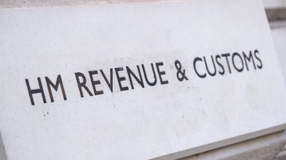 His Majesty's Revenue and Customs (HMRC) sign engraved in stone in Whitehall, London.