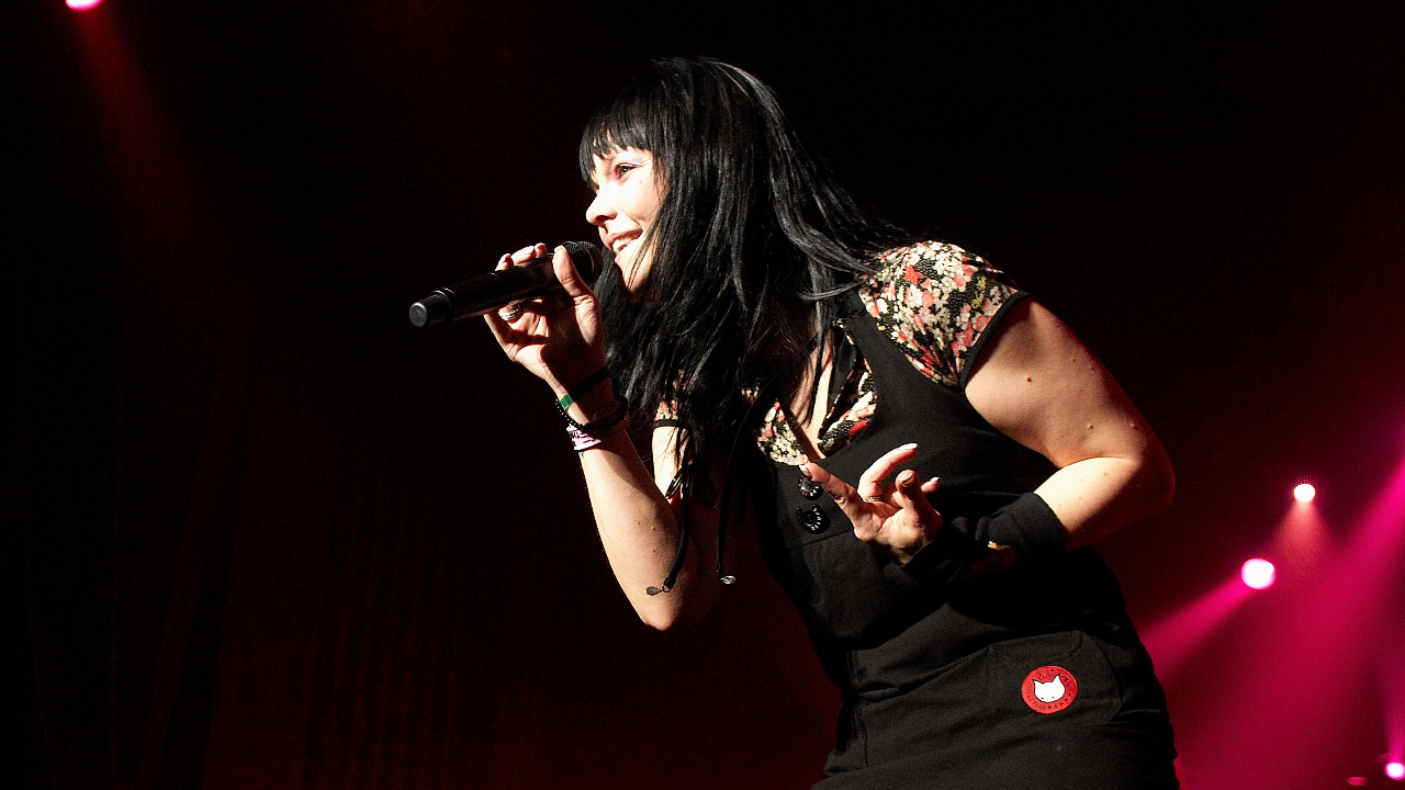 Anette singing on stage