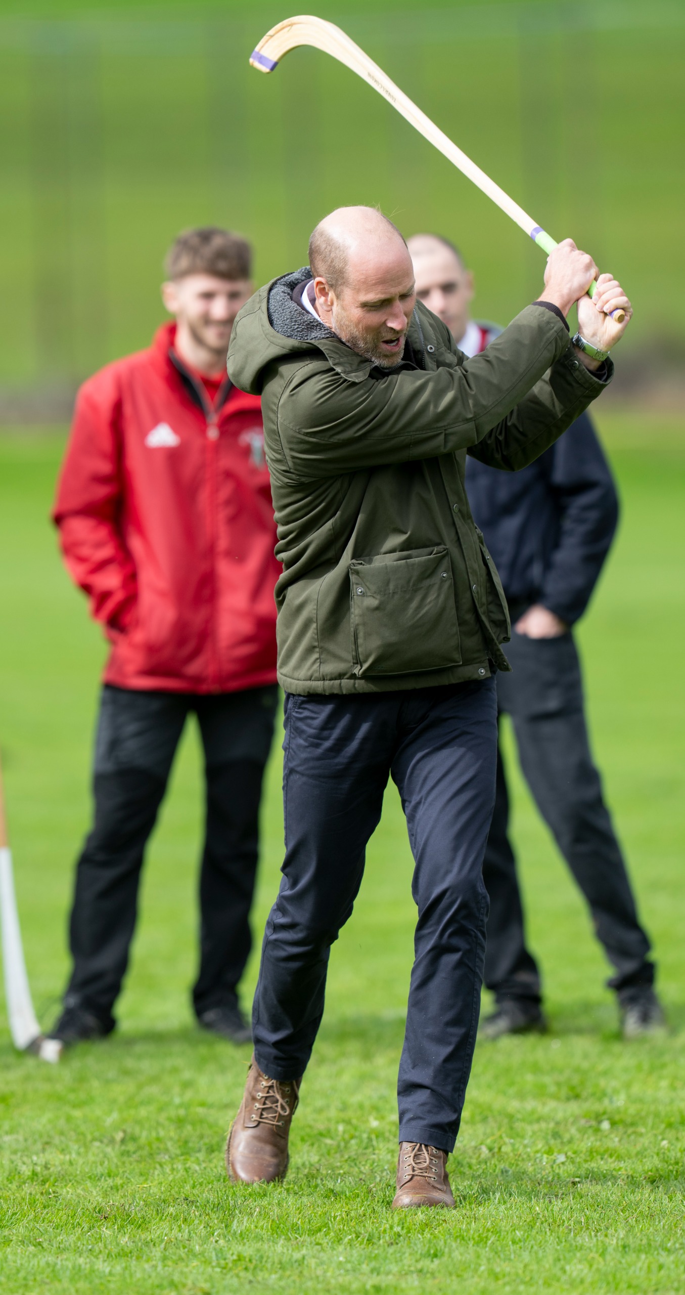 Prince William swinging a shinty stick