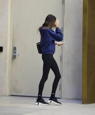 Kaia Gerber wearing leggings and nikes in new york city