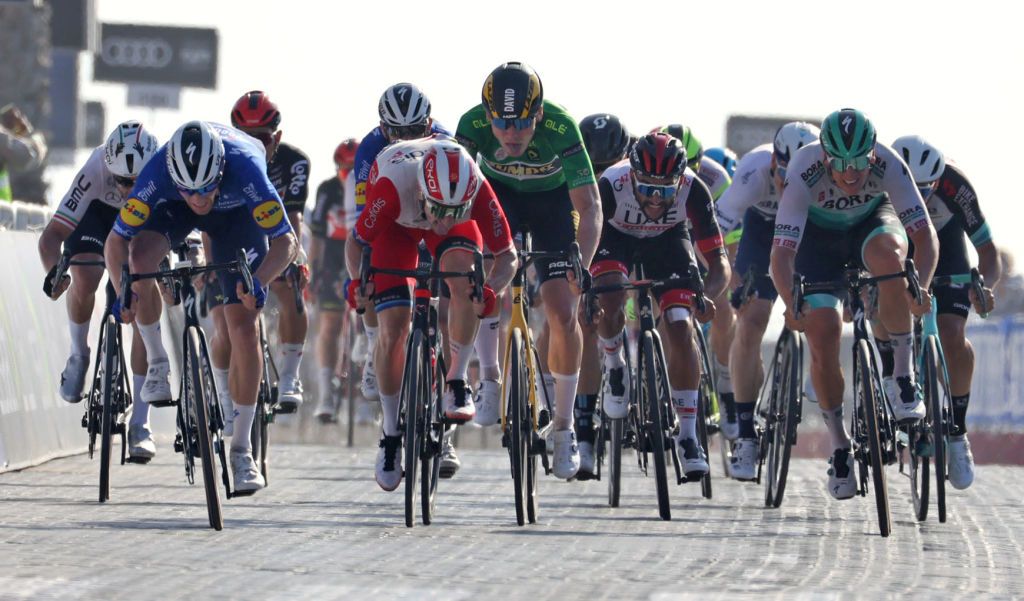 Sam Bennett L of Deceuninck Quick Step team wins the sixth stage of the UAE Cycling Tour From Dubai Deira Islands to Dubai Palm Jumeriah on February 26 2021 Photo by Giuseppe CACACE AFP Photo by GIUSEPPE CACACEAFP via Getty Images