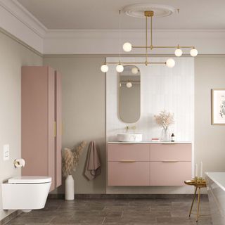 pink bathroom furniture in beige bathroom