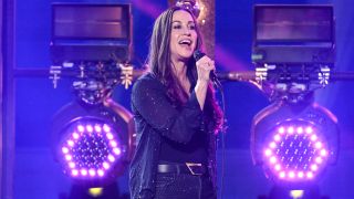 Alanis Morissette onstage at Dick Clark's New Year's Rockin' Eve with Ryan Seacrest in 2025