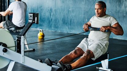 A man working out on a rowing machine