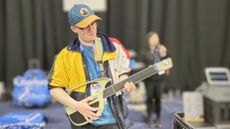 Hamish Hector playing the LiberLive C1 stringless guitar