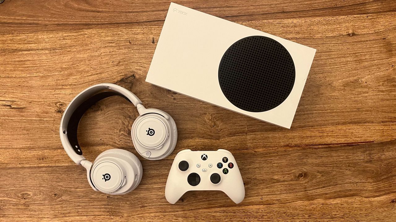 The SteelSeries Arctis Nova 7X Wireless on a table with an Xbox Series S.