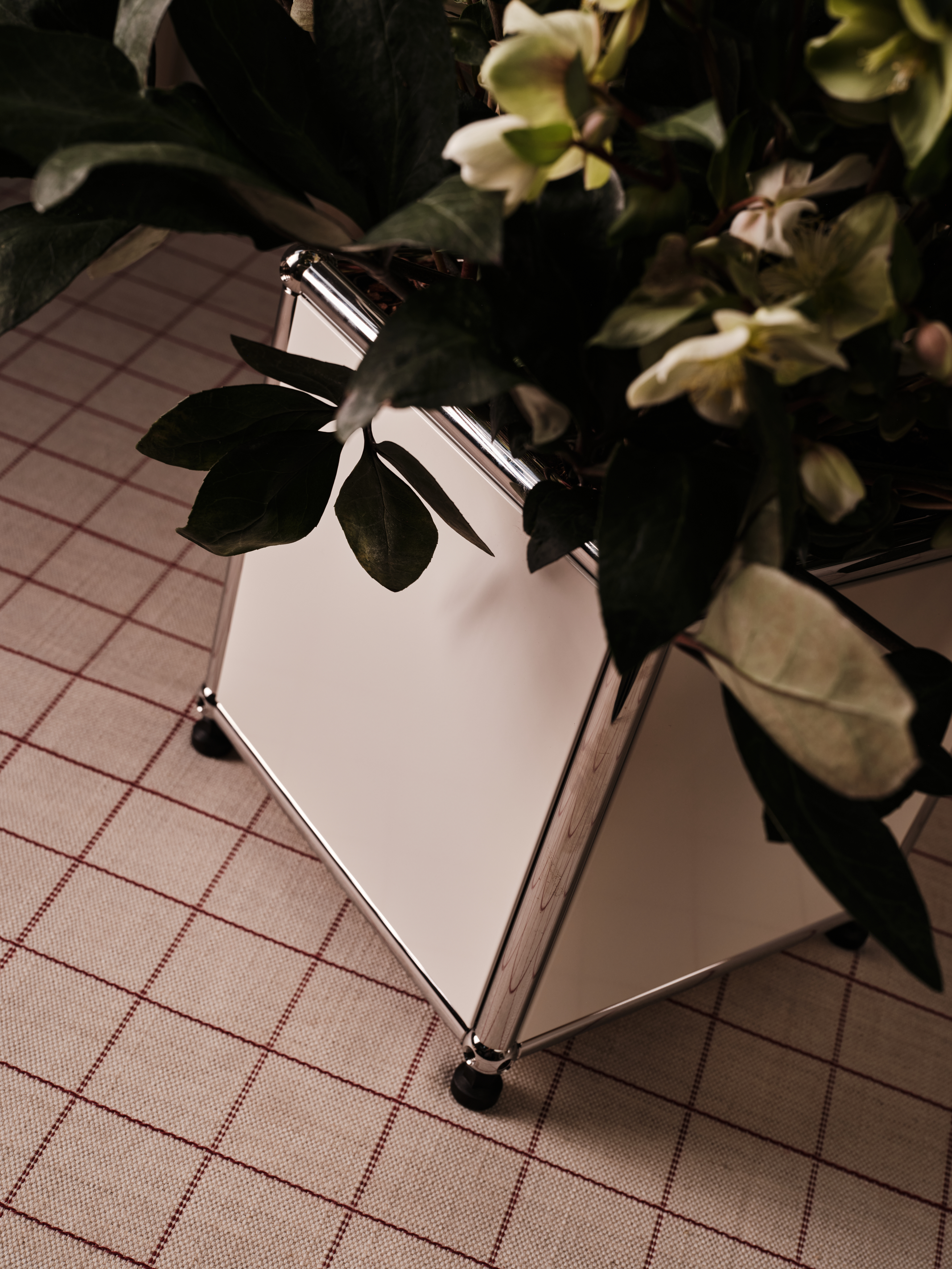 A series of shots depicting a festive Christmas tree, flowers, candles, and accessories setup.