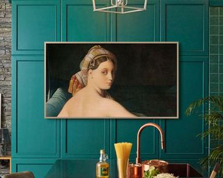 Samsung The Frame 85-inch TV in Art Mode mounted to green kitchen wall
