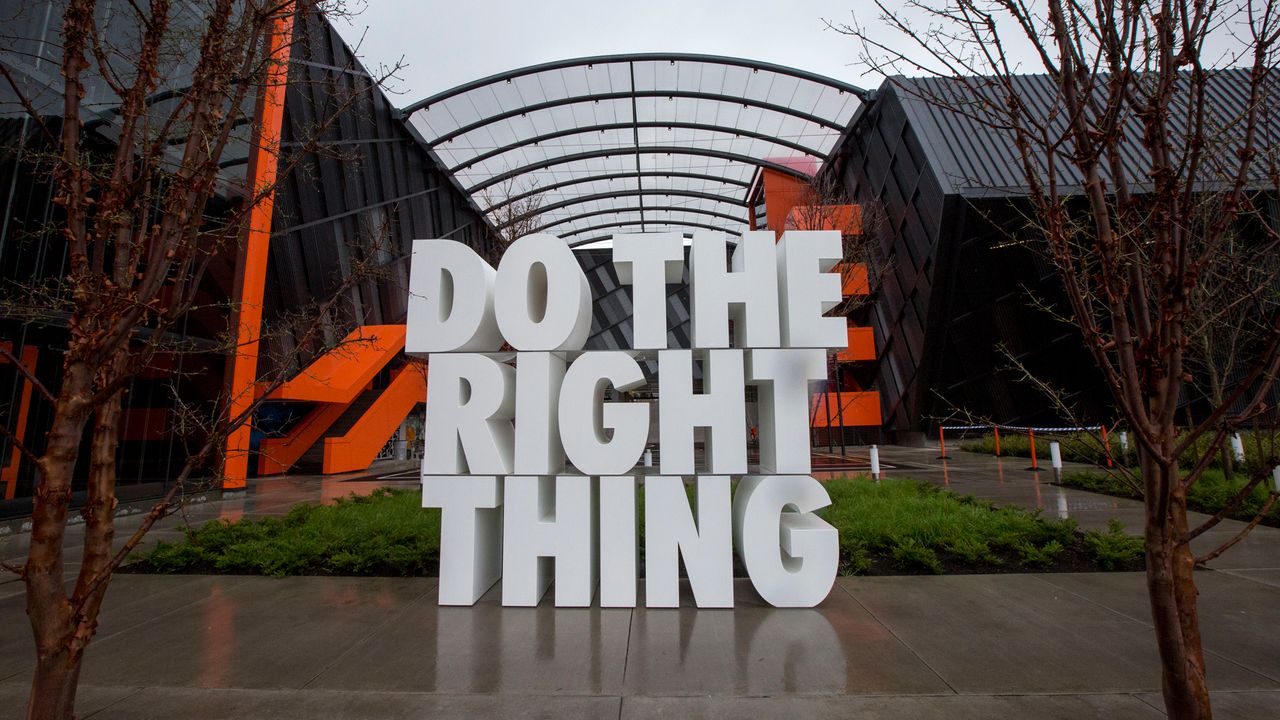 Nike Headquarters in Oregon. A white sign outside the building reads, &quot;Do the right thing&quot;.