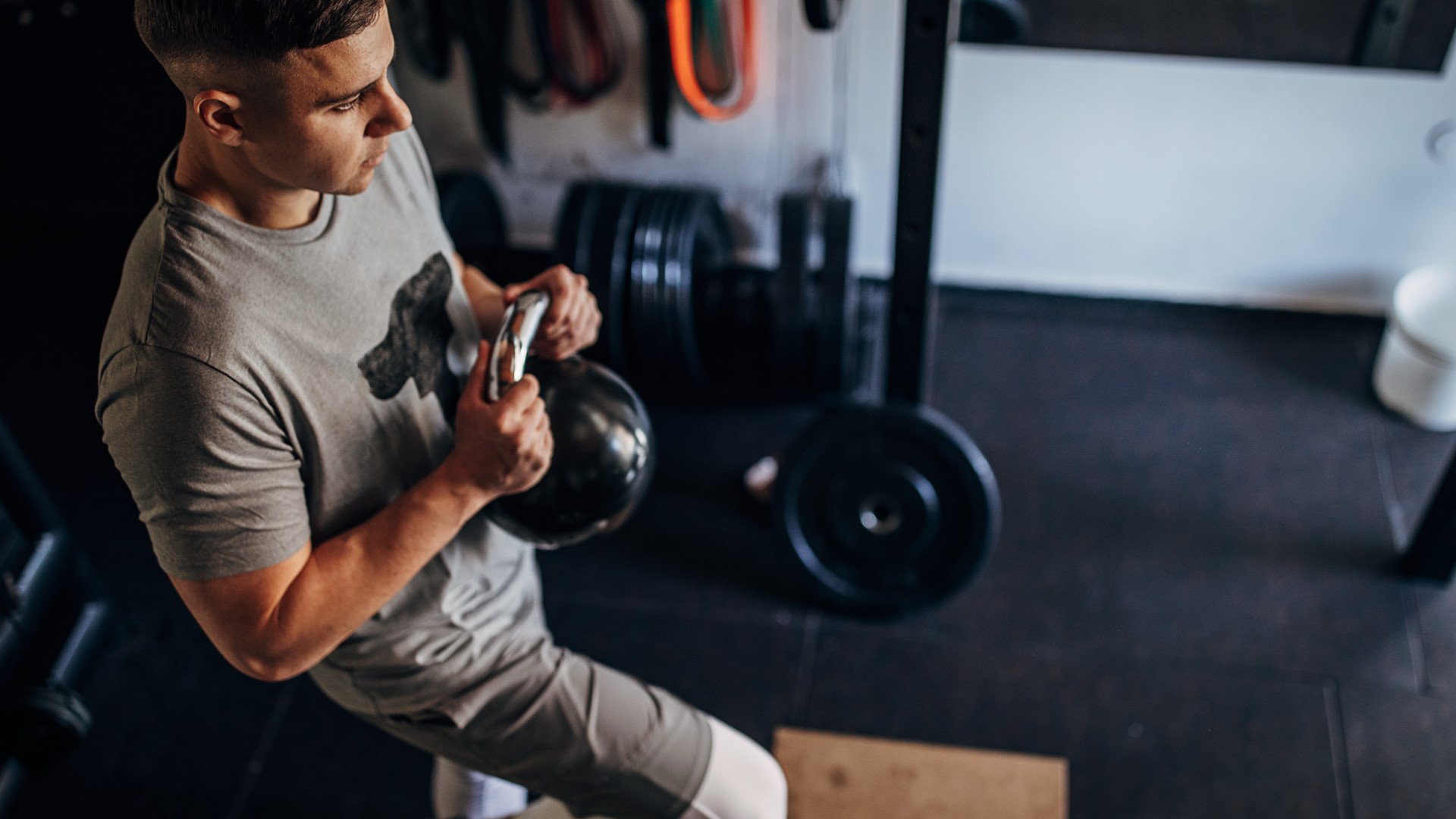 A man doing kettlebell exercises