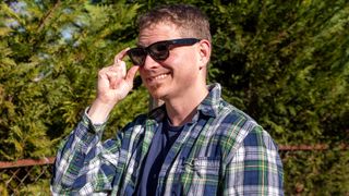 Using the touchpad on the side of Ray-Ban Stories smart glasses