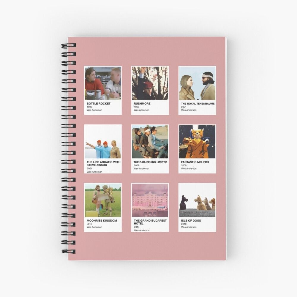 Notebook pink dengan desain Polaroid di bagian depan