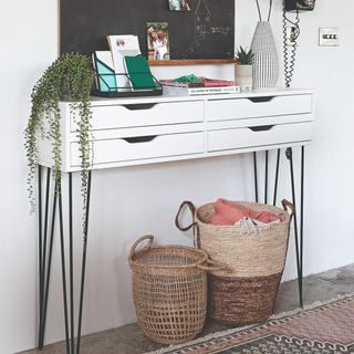 A hallway with a DIY console table made with IKEA drawer shelves and hairpin legs