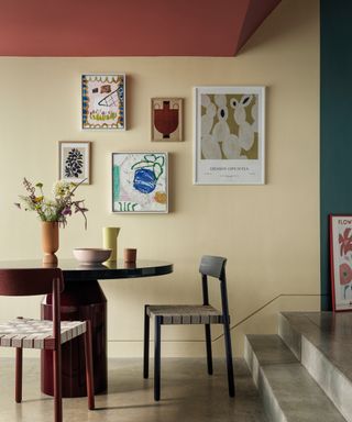 Painted dining room with large table and colorful walls