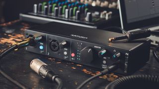 Arturia MiniFuse 2 audio interface with a music production laptop