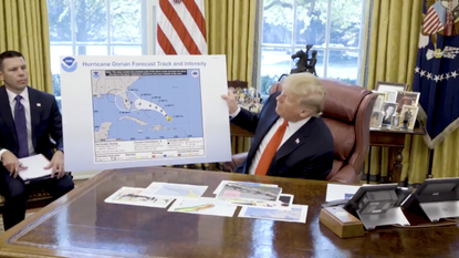 Trump with a doctored map of Dorian's projection.