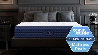 The DreamCloud Luxury Hybrid Mattress UK shown on a black bedframe in a black bedroom and with a Black Friday mattress deals badge overlaid on the image
