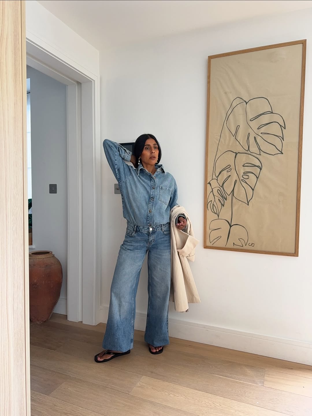 Monikh in double denim and black flip-flops