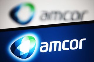 Amcor logo on smartphone with logo also blurred in the background
