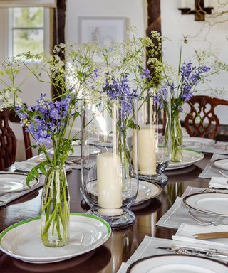 dining table with candles flower vase