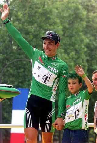 Erik Zabel, joined by son Rick, receives his fifth green jersey at the 2000 Tour de France. Rick is now taking after his father and is a successful Junior racer.
