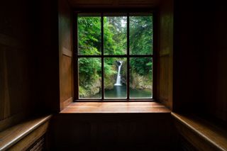 The view of a waterfall through a window