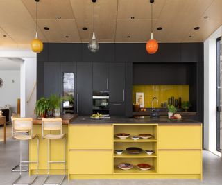 yellow kitchen island with seating