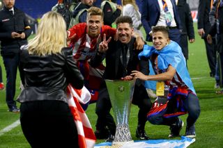 Diego Simeone celebrates with sons Giuliano and Gianluca after winning the Europa League for a second time with Atletico Madrid in 2018.