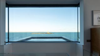 huge contemporary window with sea views