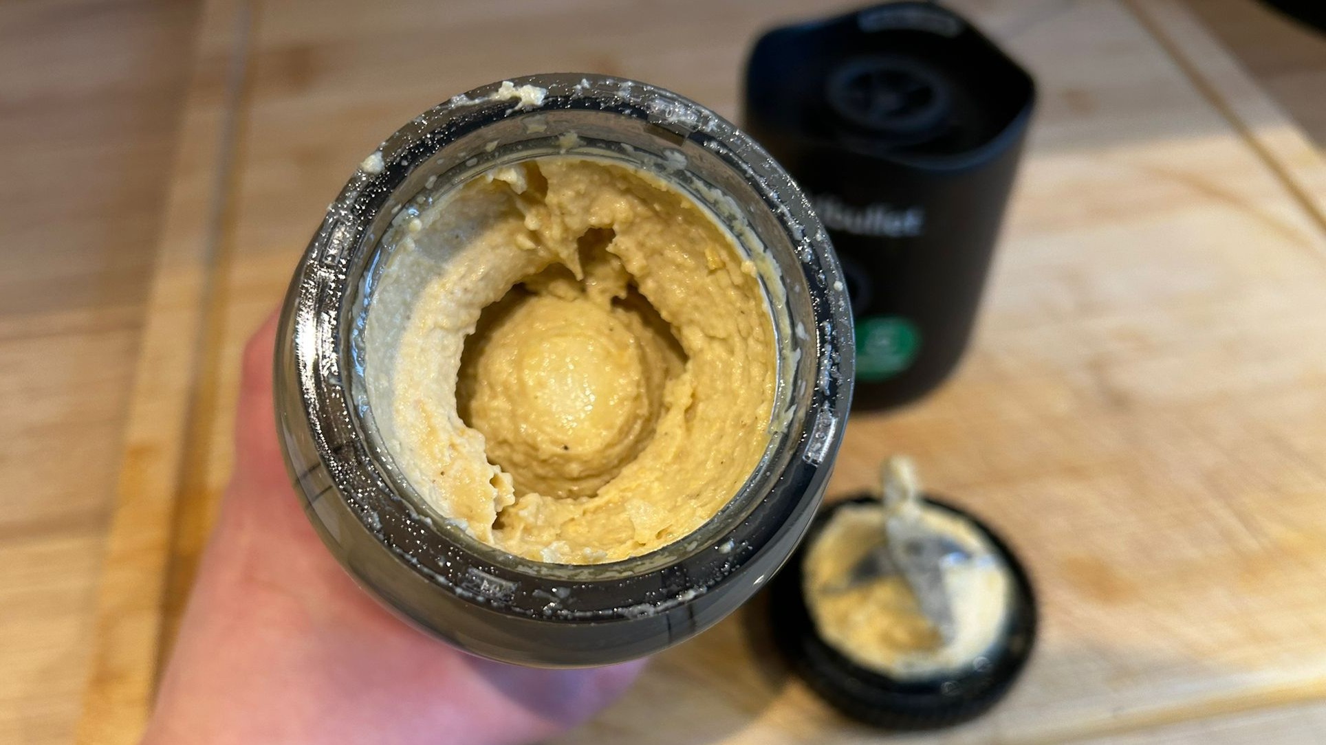 Nutribullet Flex blender containing blended hummus